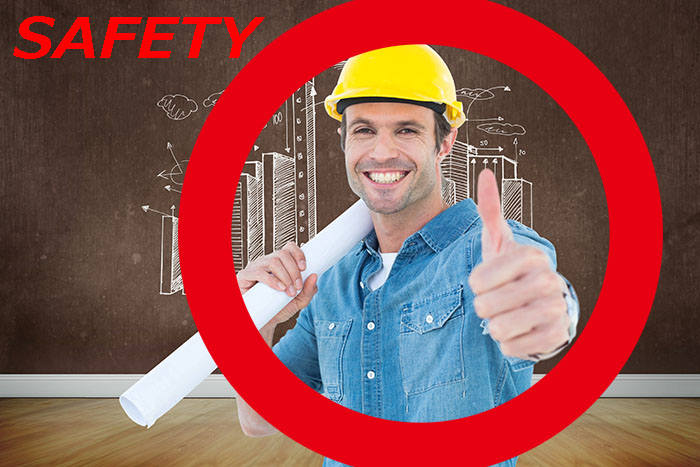 architect holding blueprint while gesturing thumbs up